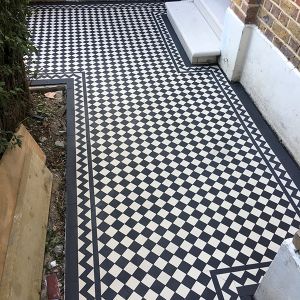 victorian black and white floor tiles London on the outside of a house