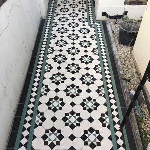black and green colour victorian outdoor tiles London as a welcoming path to the house