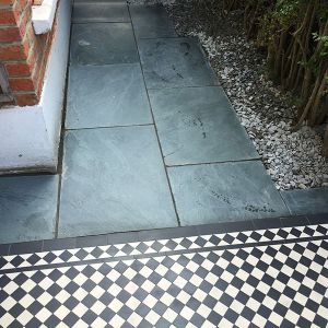paving slabs with addition of Victorian path tiles London