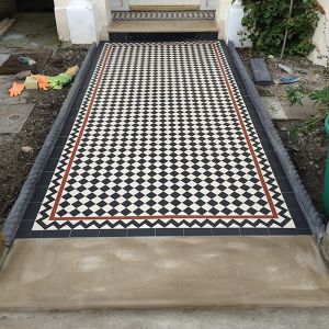 victorian path tiles London in a checkerboard pattern with brown details