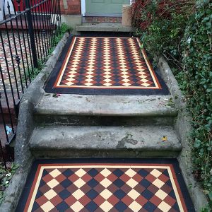 unusual victorian outdoor tiles in carpet-like style welcoming the quests of the house